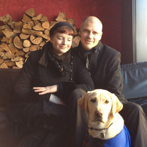 Melbourne house-sitters Dianna and Mark with Quinnell, the Guide Dog Puppy they raised in 2012.